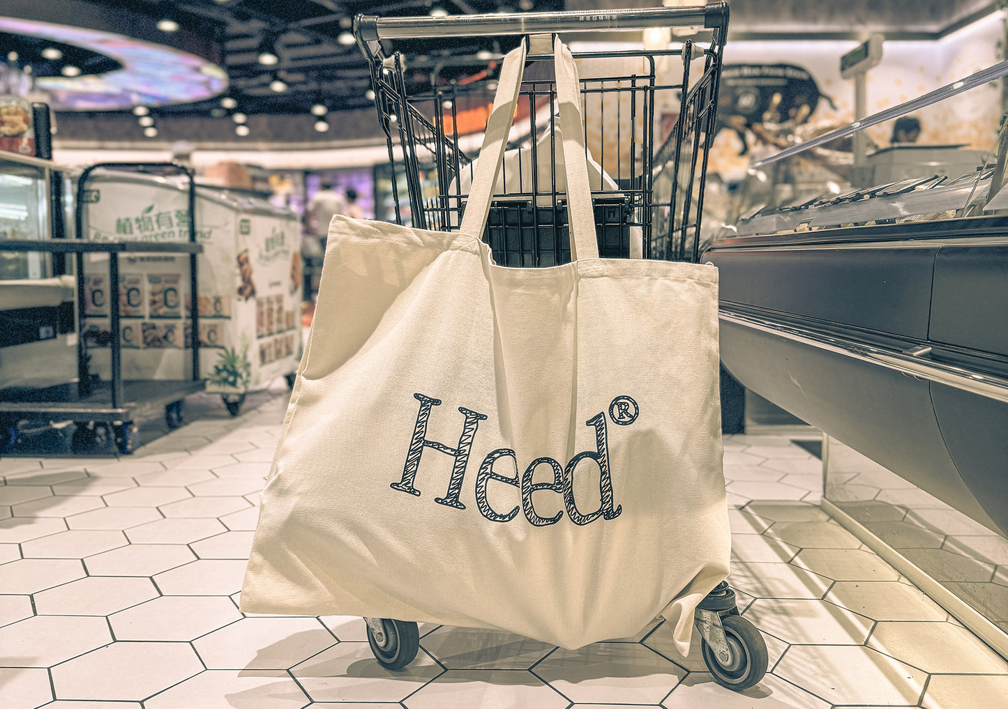 Alt text: Heed Logo Essentials XL Canvas Bag - A stylish bag featuring the iconic Heed logo, promoting mental health awareness and prioritization.""Alt text: Heed Logo Essentials XL Canvas Bag - Stylish bag with prominent Heed logo, emphasizing mental health prioritization and awareness.