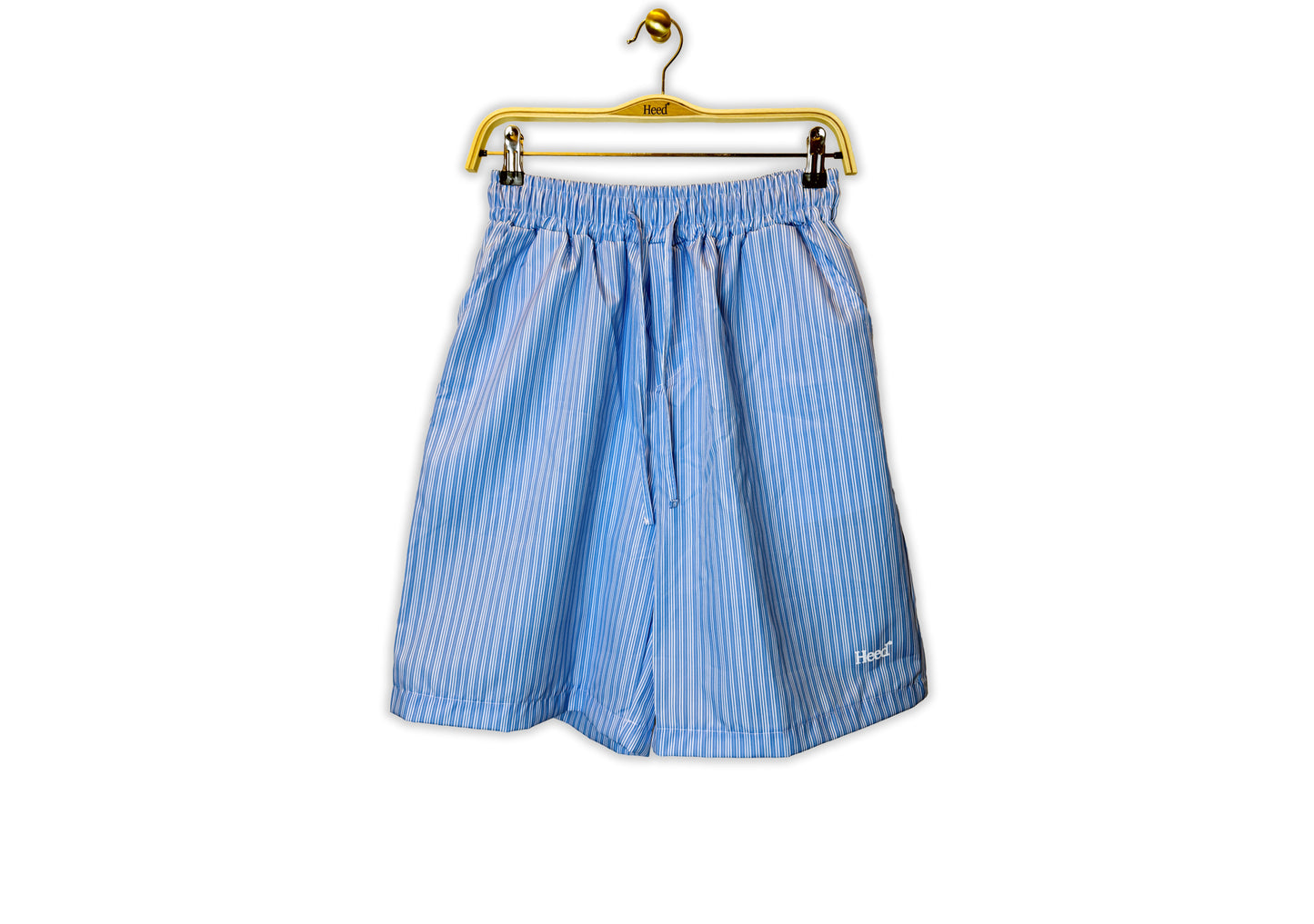 Heed Relaxed Fit Striped Drawstring Lounge Shorts:  Flat-lay image of the Heed striped drawstring lounge shorts. The shorts feature a relaxed, wide-leg silhouette in a classic striped pattern. The adjustable drawstring waistband is visible, showcasing the comfortable, customizable fit of these lightweight, breathable casual lounge pants.