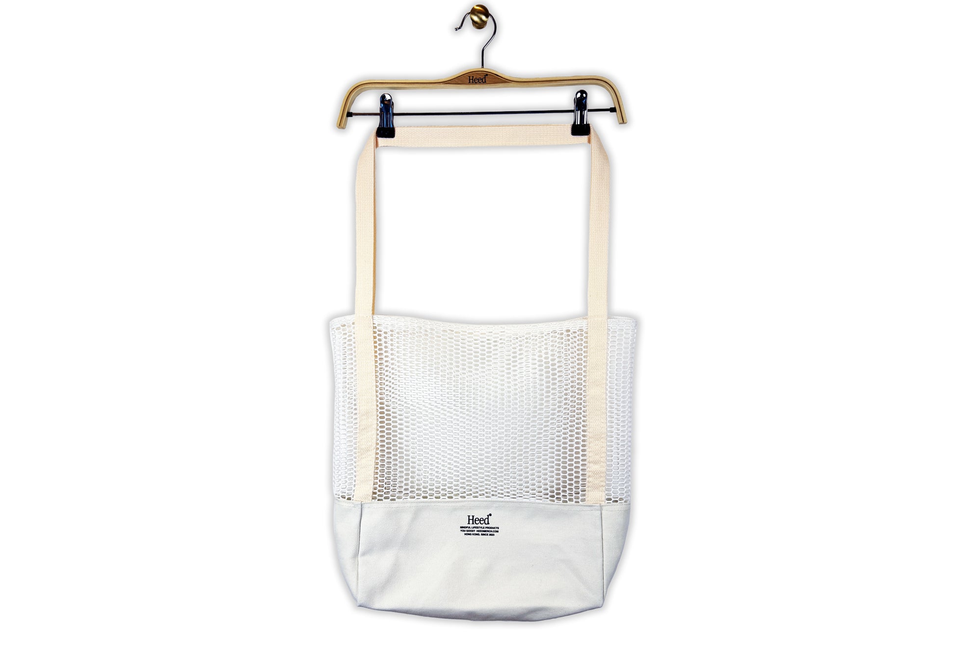 Lightweight and breathable mesh market tote bag in black and white colors. Features woven shoulder straps and screen-printed Heed logo detailing. From your Mental Health and Self Care Streetwear Clothing Brand. Black, White and Navy t-shirt.